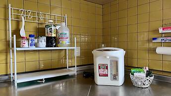 Yellow House by Lake Toya