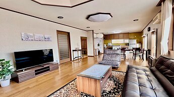 Yellow House by Lake Toya