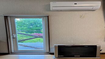 Yellow House by Lake Toya