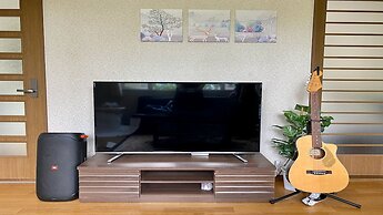 Yellow House by Lake Toya