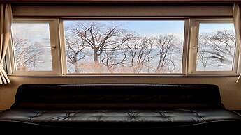 Yellow House by Lake Toya