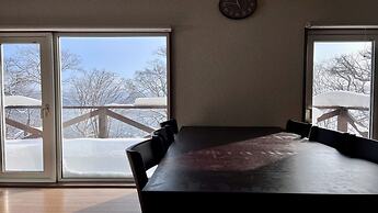 Yellow House by Lake Toya