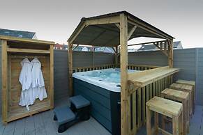 THE Bells hot tub on Private Terrace Apartments