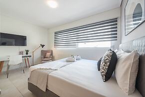 Luxury Loft with a Balcony by CloudKeys