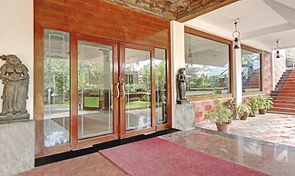 Treebo Trend Green Palm Resorts