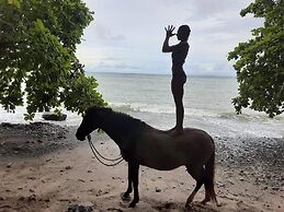 Surrounded By Trees In Front Of The Sea