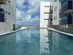 Bela Hospedagem - Vista piscina e mar