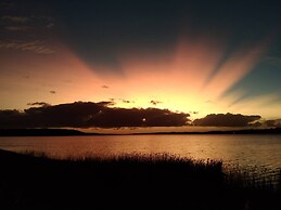 Log Cabin On And Overlooking a 9km Lagoon