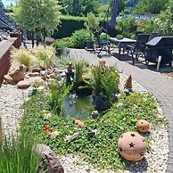 Garden Retreat With Pond View
