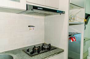 Homey And Warm Studio Room At Tifolia Apartment