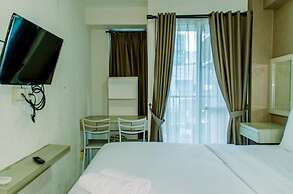 Homey And Warm Studio Room At Tifolia Apartment