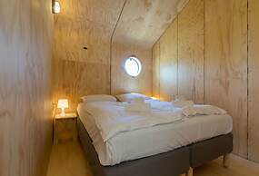 Tiny Wrap-around House on the Edge of Beach