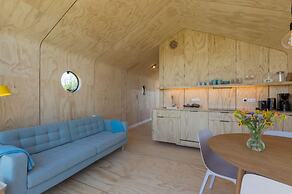 Tiny Wrap-around House on the Edge of Beach