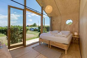 Tiny Wrap-around House on the Edge of Beach