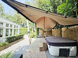 Chalet Kieftveen With hot tub for Four Person