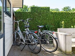 Chalet Kieftveen With hot tub for Four Person