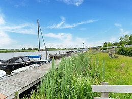 Relaxing Holiday Chalet by the Water in Grou