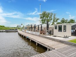 Relaxing Holiday Chalet by the Water in Grou