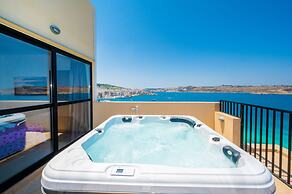 Islet Seafront Penthouse with Hot tub