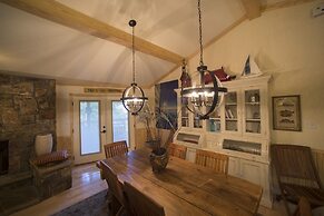 Lake view three bedroom, three bath cottage with private hot tub overl