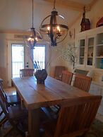 Lake view three bedroom, three bath cottage with private hot tub overl