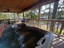 Lake view two bedroom, two bath log-sided cottage with private hot tub