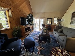 Lake view two bedroom, two bath loft, log-sided cottage with private h