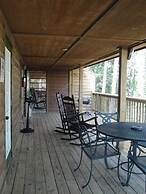 Lake view two bedroom, two bath log-sided cottage with private hot tub