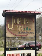 JI6, King Guest Room at the Joplin Inn at entrance to the resort by Re