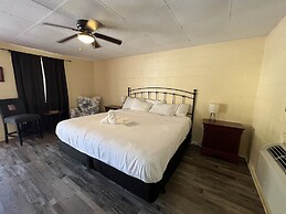 JI6, King Guest Room at the Joplin Inn at entrance to the resort by Re