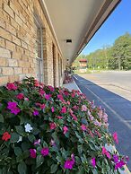 JI6, King Guest Room at the Joplin Inn at entrance to the resort by Re