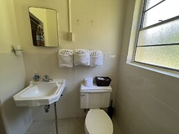 Queen Guest Room located at the Joplin Inn at the entrance to Mountain