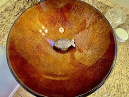 King Studio with king bed, dining area, sleeper sofa and view of Lake 