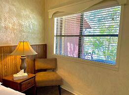 King Studio with king bed, dining area, sleeper sofa and view of Lake 