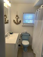 Sandy Mutts At The Beach 1 Bedroom Cottage by RedAwning