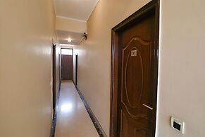 FabHotel Happy Residency