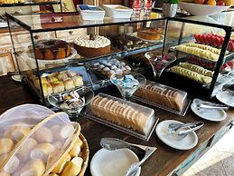 Center Suíço Flats e Shopping