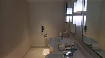 Capital O 950 Acqua Novotel Tower