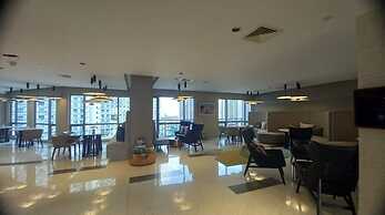 Capital O 950 Acqua Novotel Tower