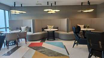 Capital O 950 Acqua Novotel Tower