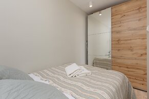 Aleja Jana Pawla II Studio by Renters