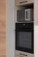 Aleja Jana Pawla II Studio by Renters