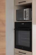 Aleja Jana Pawla II Studio by Renters