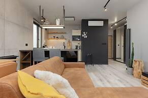Industrial Bemowo Apartment by Renters