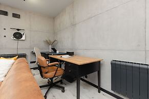 Industrial Bemowo Apartment by Renters