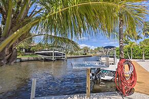 Palm City Canalfront Home w/ Tiki Hut & Dock!