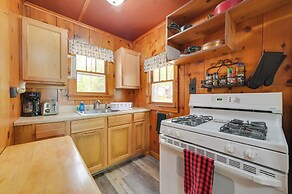 Cozy Carp Lake Cottage w/ Dock, Kayaks & Fire Pit