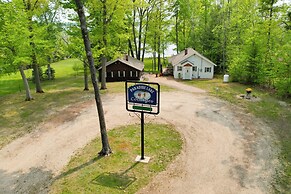 Cozy Carp Lake Cottage w/ Dock, Kayaks & Fire Pit