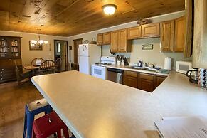 Burns Lake Cabin w/ Dock, Fire Pit, Rowboat & More