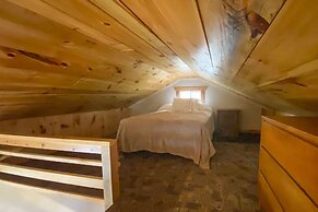 Burns Lake Cabin w/ Dock, Fire Pit, Rowboat & More